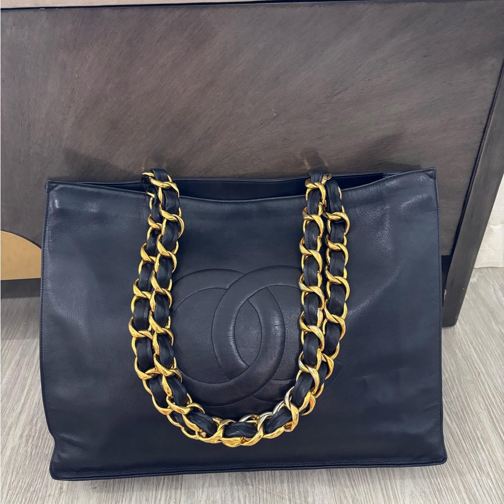 CHANEL Black Leather Tote with Gold Chain-Strap Accent